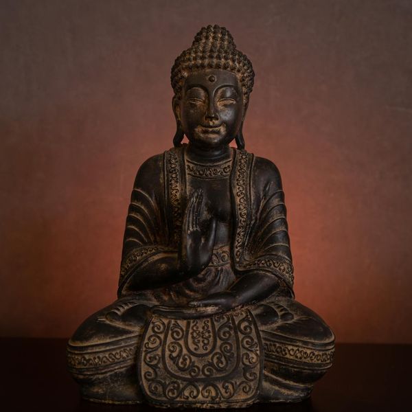 Ancient scroll with yoga symbols bathed in soft light.